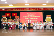 N.A. President presents Party-membership badges to veteran members